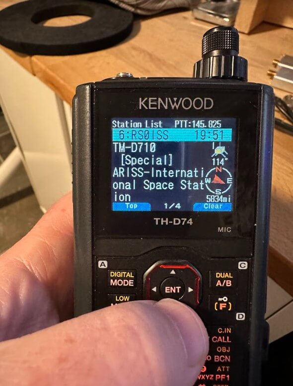 A Kenwood TH-D74 displays a packet received from the ISS, which uses the call sign RS0ISS for its APRS radio. Photo by Jim Reed - N4BFR