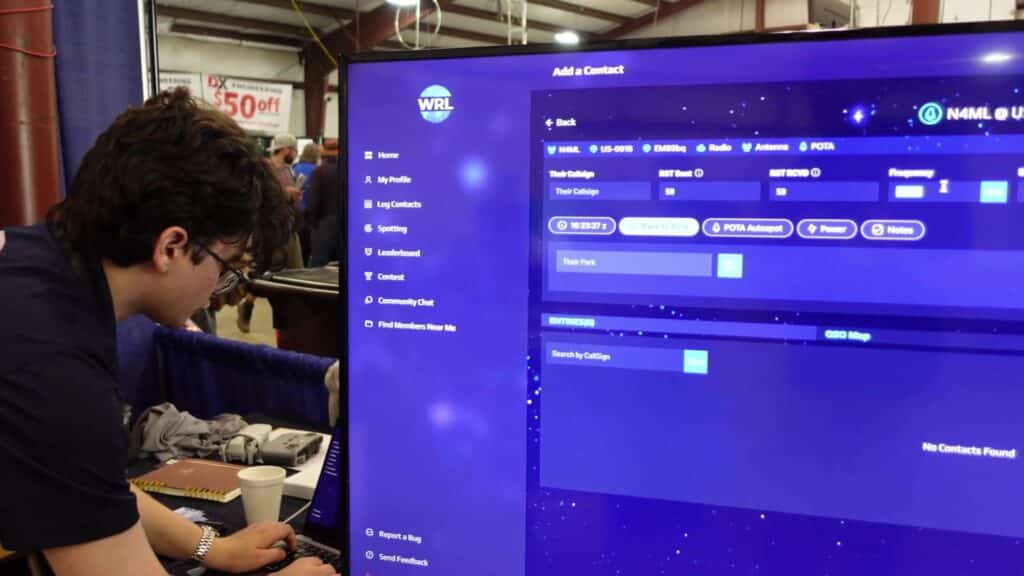 Person operating on world radio league POTA features on screen