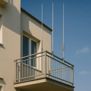 A vertical antenna mounted on a balcony for HF operations